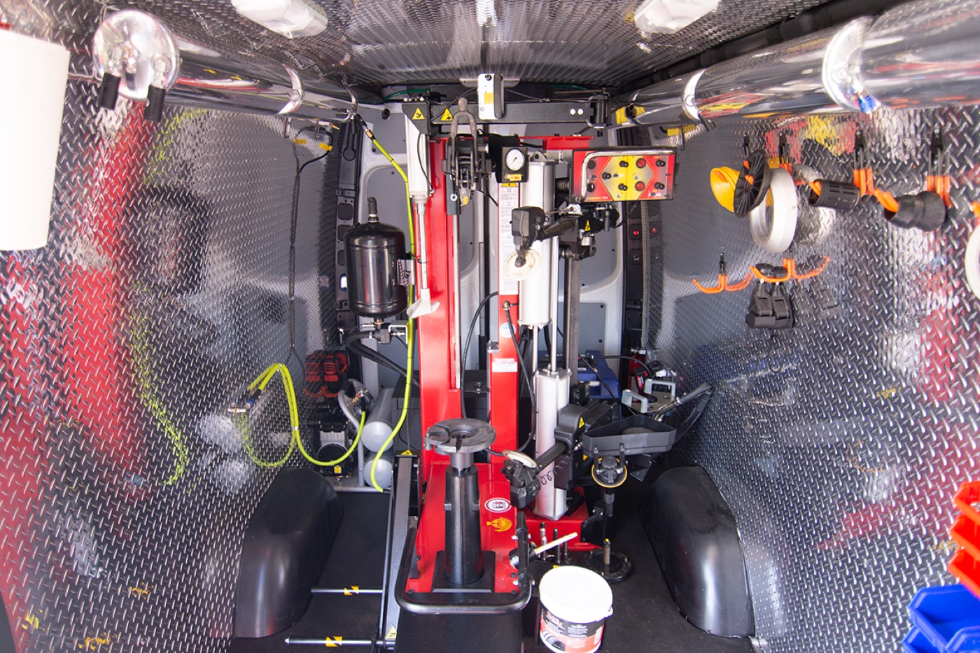 Inside a GoMobile Tires van: tire changer, wheel balancer and tools